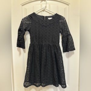 Girls black bell sleeved dress. Size medium